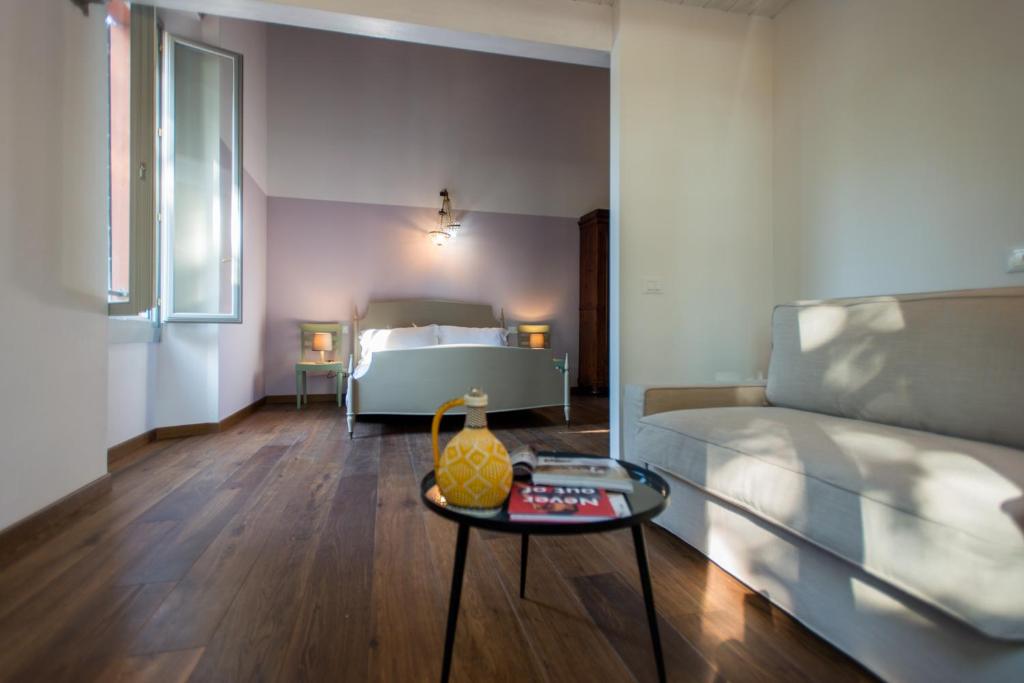 a bedroom with a bed and a table with a table at La Milzetta in Russi