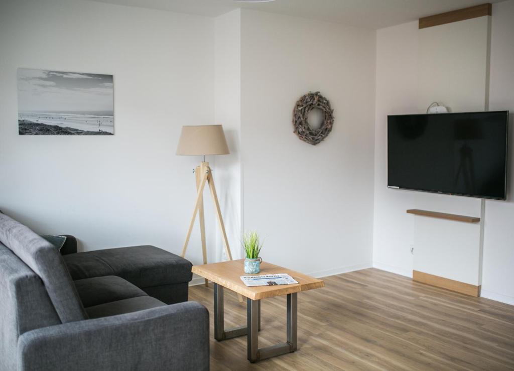 TV a/nebo společenská místnost v ubytování Haus NordQuartier