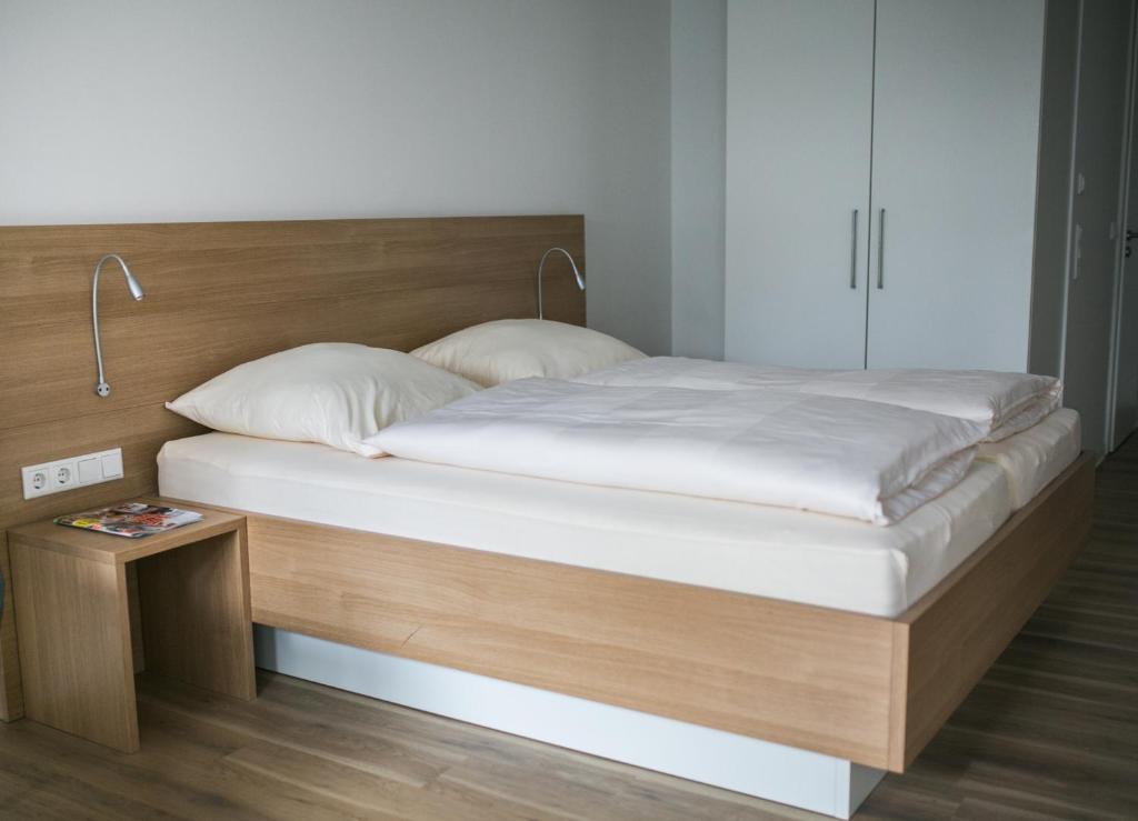 Postel nebo postele na pokoji v ubytování Haus NordQuartier