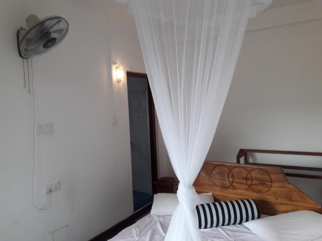 Postel nebo postele na pokoji v ubytování Elegant Home Stay