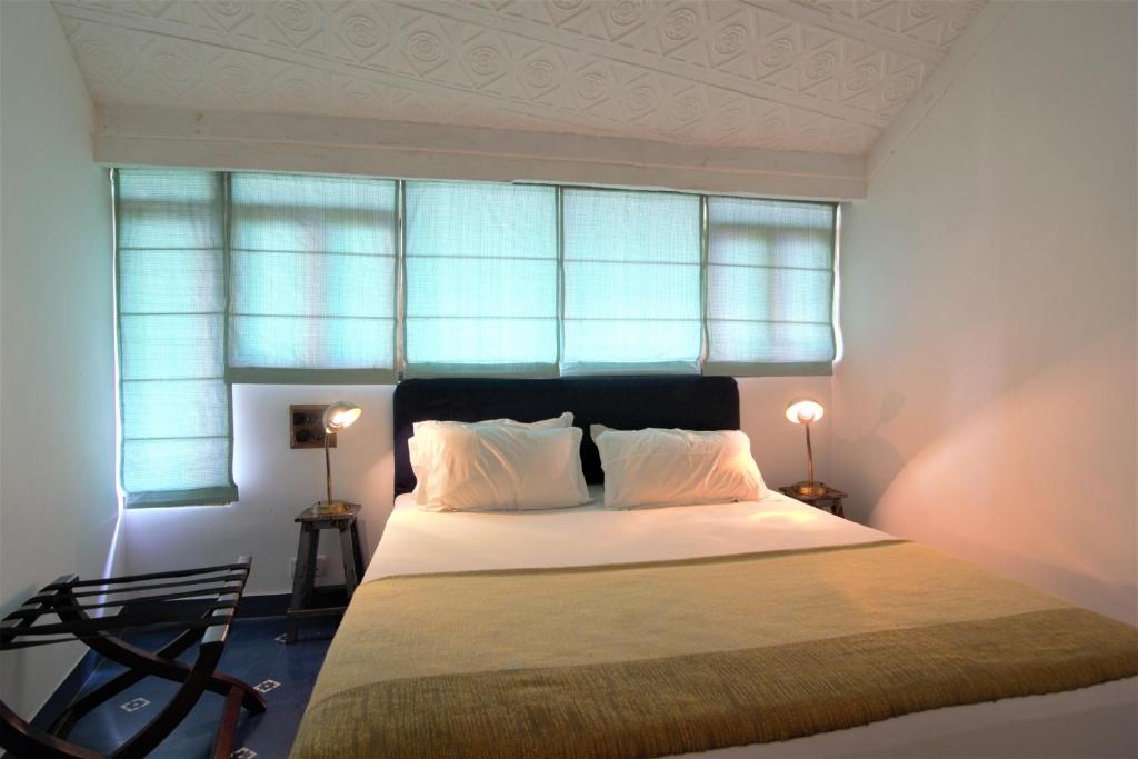 Postel nebo postele na pokoji v ubytování Mateus Boutique Hotel