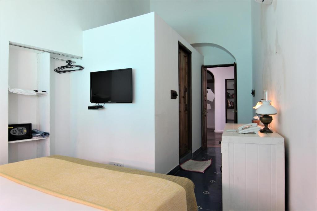TV a/nebo společenská místnost v ubytování Mateus Boutique Hotel