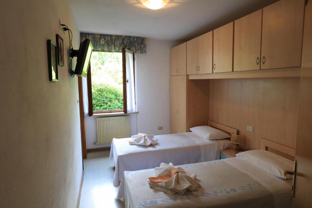 Postel nebo postele na pokoji v ubytování Hotel Aurora