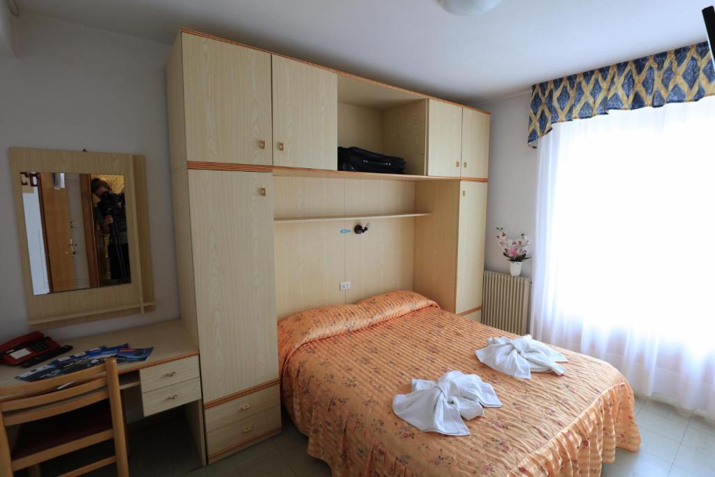 Postel nebo postele na pokoji v ubytování Hotel Aurora