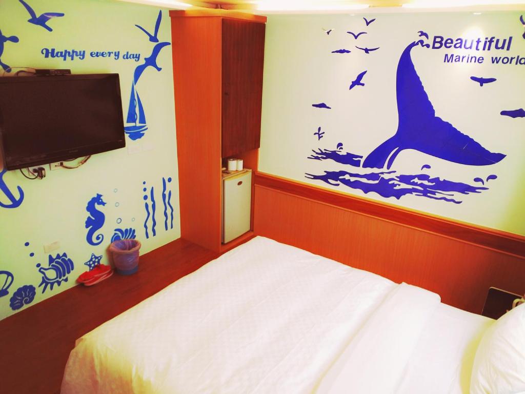 Postel nebo postele na pokoji v ubytování Hong Ben Hotel