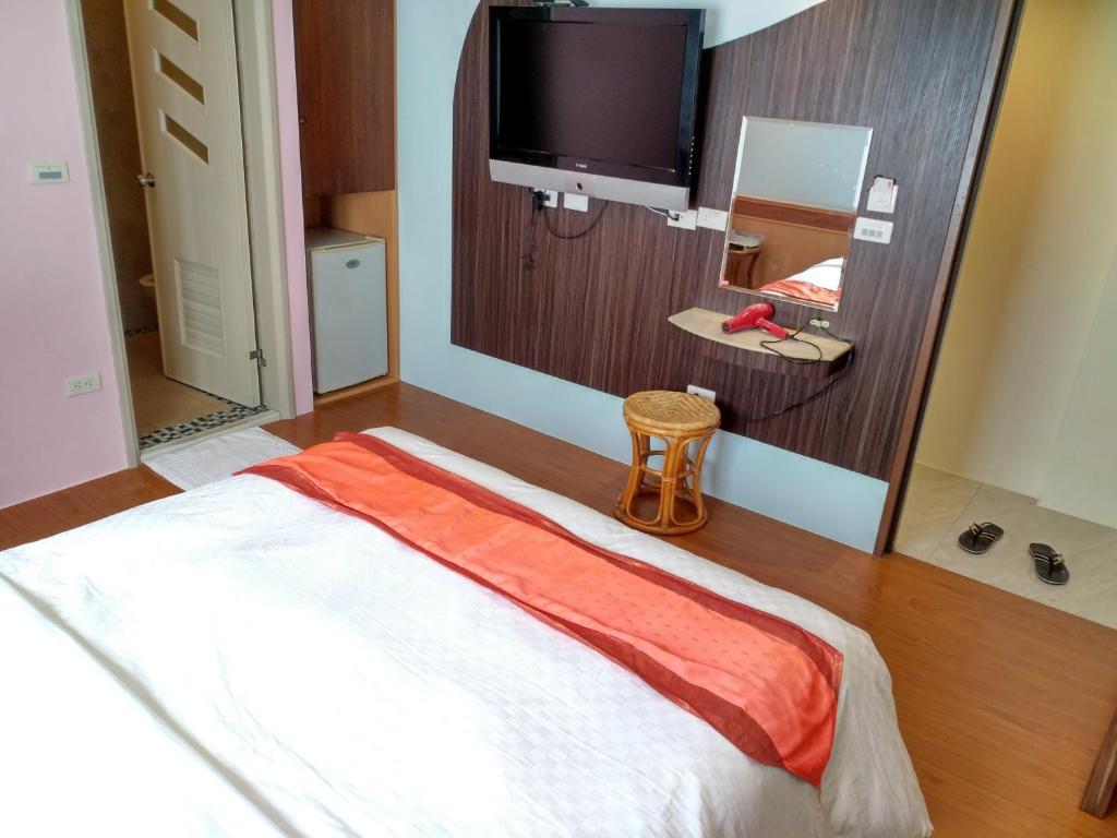 Säng eller sängar i ett rum på Hong Ben Hotel