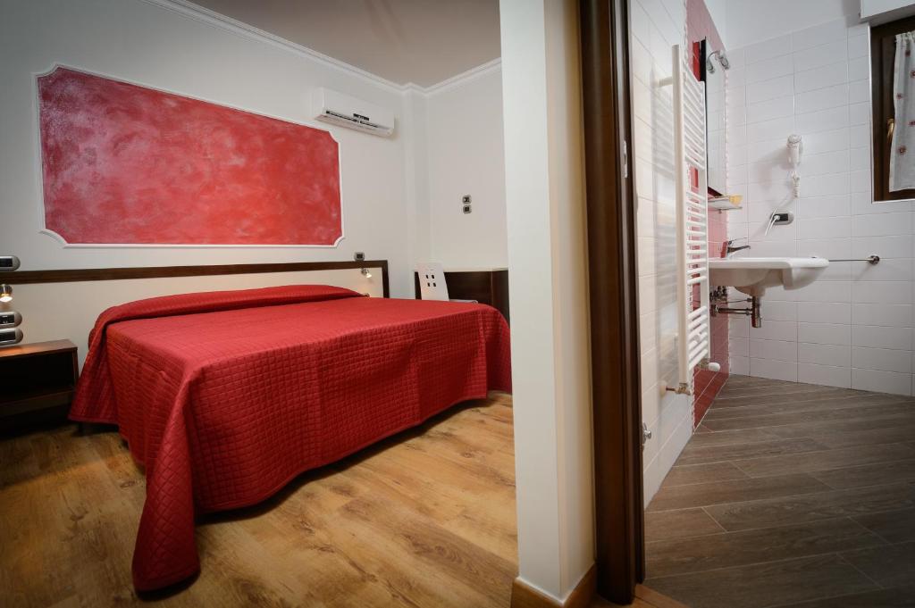 Postel nebo postele na pokoji v ubytování B&B Le Gemme