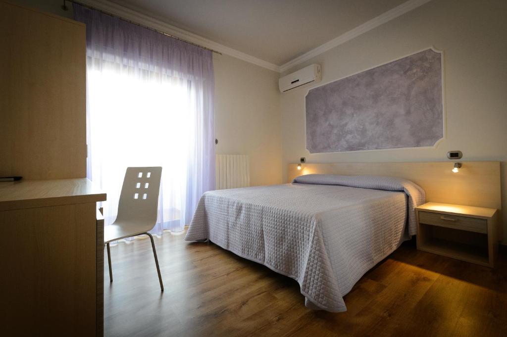 Postel nebo postele na pokoji v ubytování B&B Le Gemme