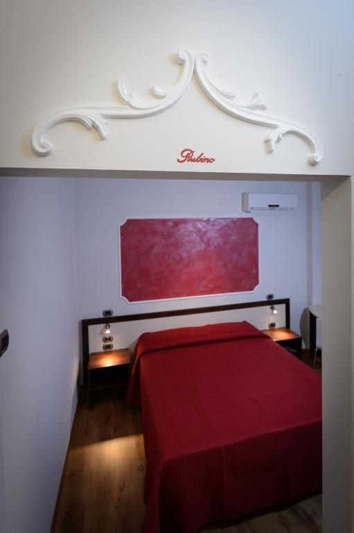 Postel nebo postele na pokoji v ubytování B&B Le Gemme
