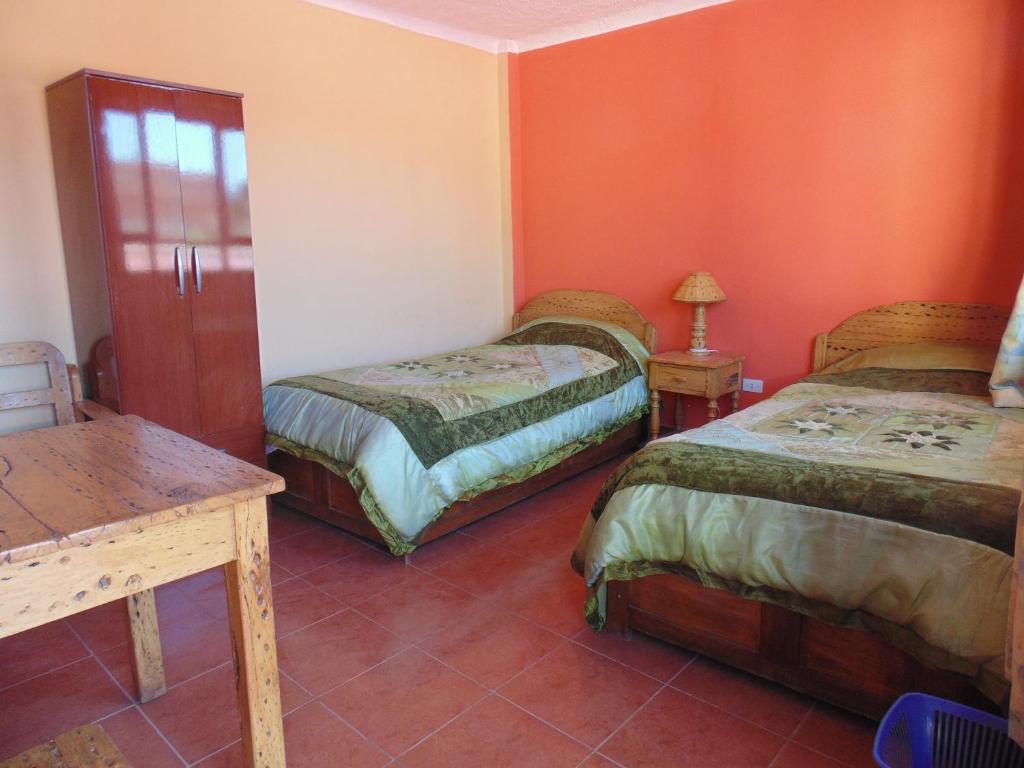Hostal Coronel Pedro Arraya客房内的一张或多张床位
