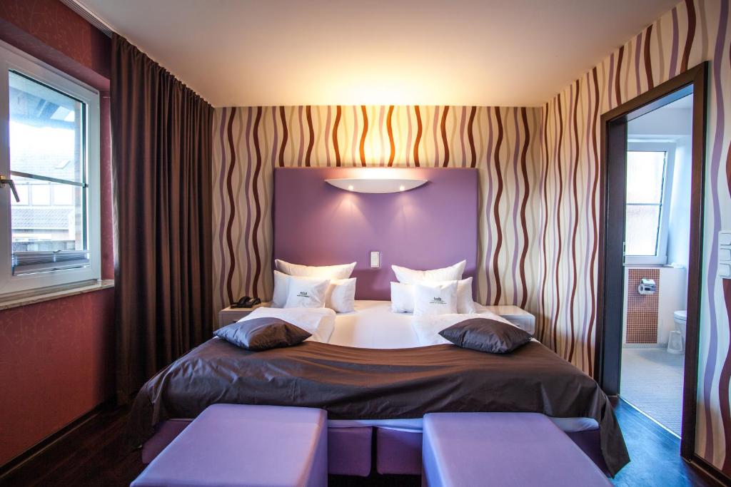 Voodi või voodid majutusasutuse Retro Design Hotel toas