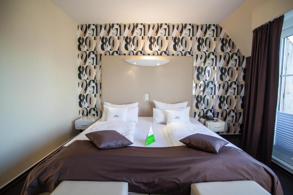 Voodi või voodid majutusasutuse Retro Design Hotel toas