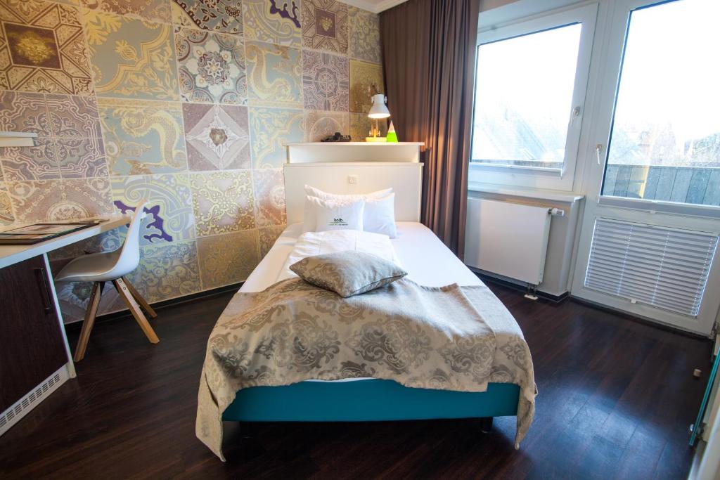 Voodi või voodid majutusasutuse Retro Design Hotel toas
