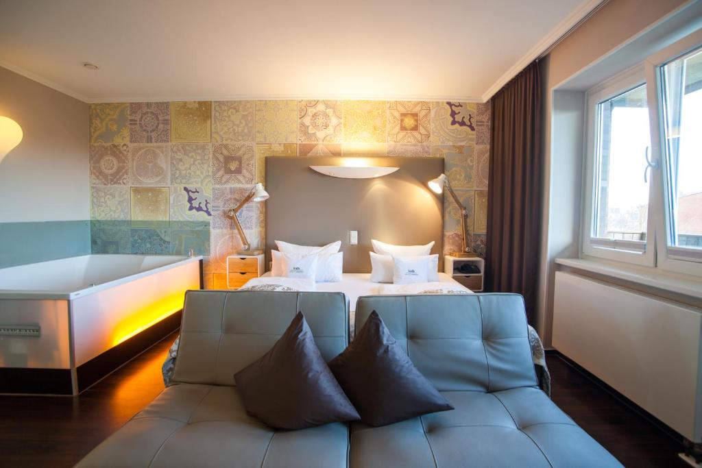 Voodi või voodid majutusasutuse Retro Design Hotel toas