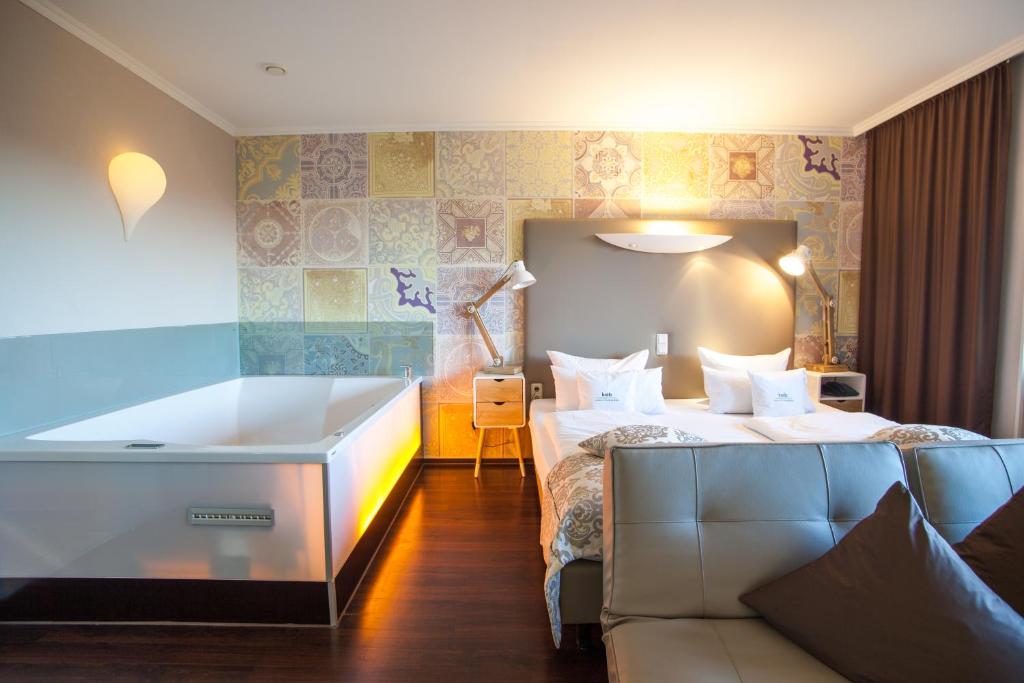 Voodi või voodid majutusasutuse Retro Design Hotel toas