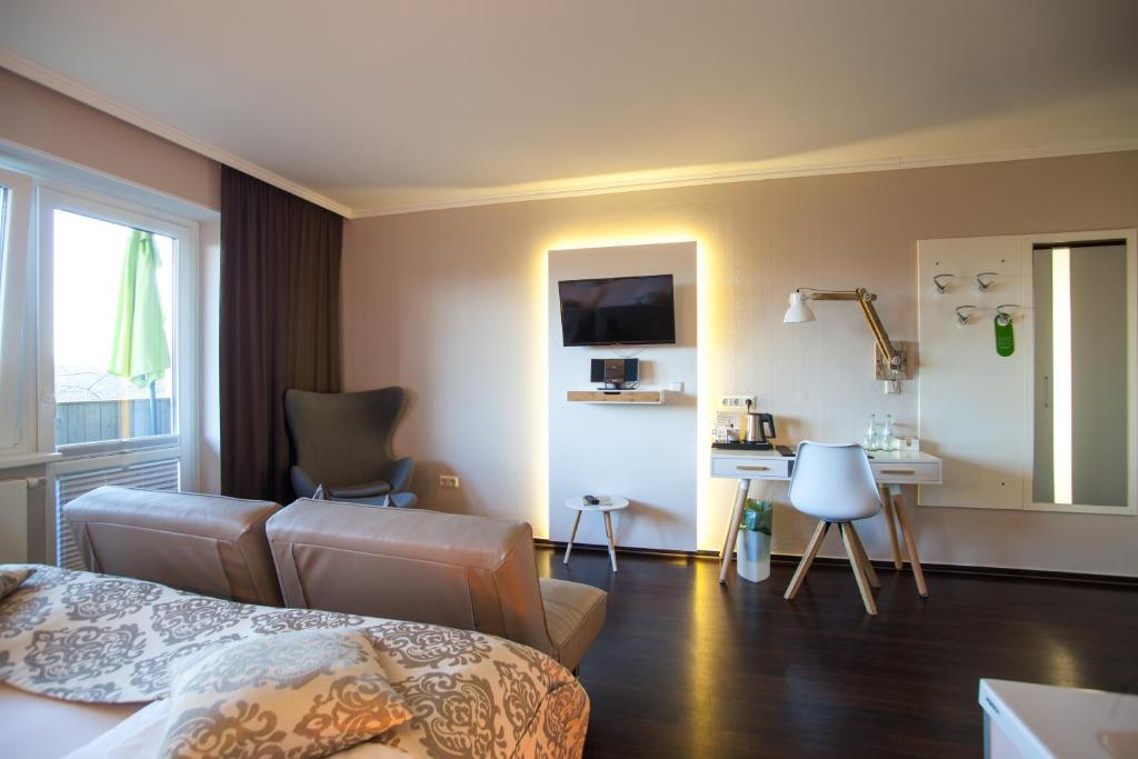 Televiisor ja/või meelelahutuskeskus majutusasutuses Retro Design Hotel