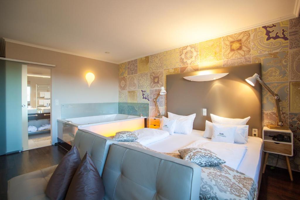 Voodi või voodid majutusasutuse Retro Design Hotel toas