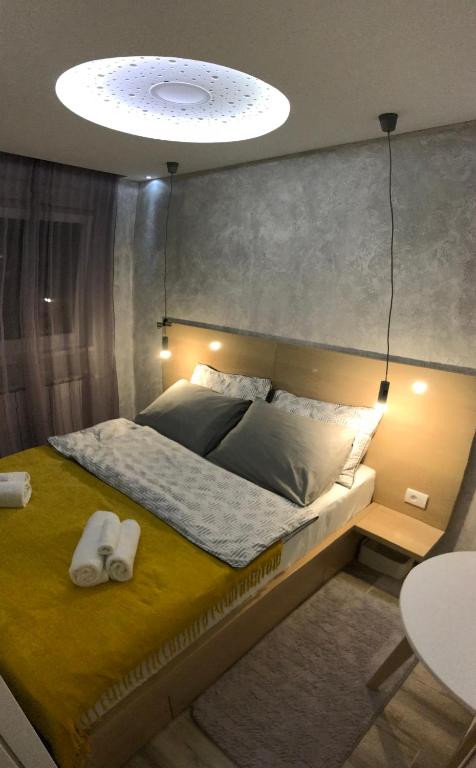 מיטה או מיטות בחדר ב-Lola Apartments