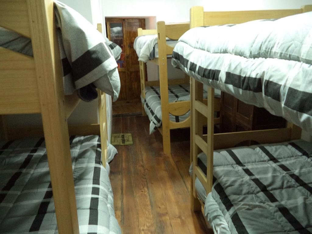 Uma cama ou camas num quarto em Gringo's Wasi