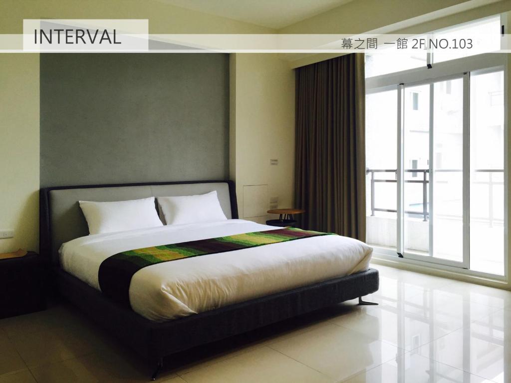 A bed or beds in a room at Interval