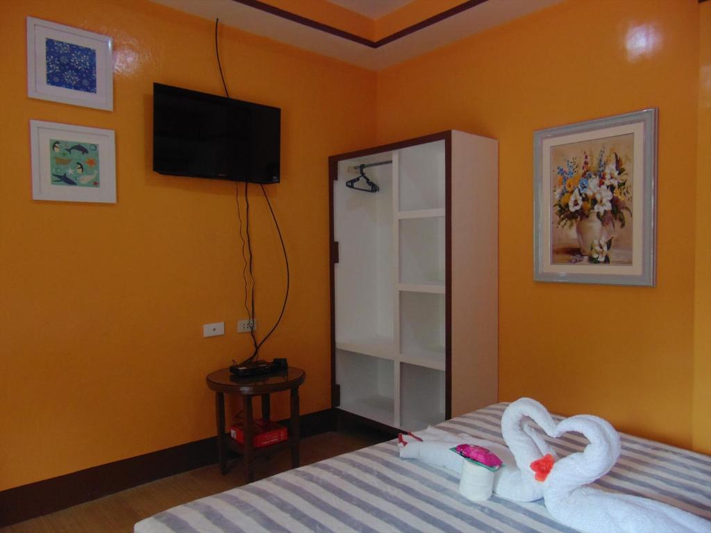 Postel nebo postele na pokoji v ubytování Stefanie Grace Paradise Inn