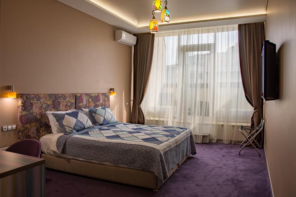 Postel nebo postele na pokoji v ubytování Horizon Hotel