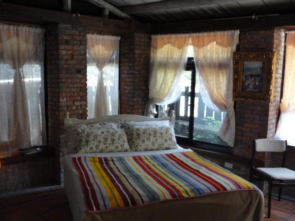 Postel nebo postele na pokoji v ubytování Jiufen Aromatherapy B&B