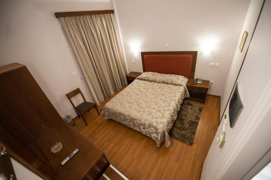 Postel nebo postele na pokoji v ubytování Hotel Olympos