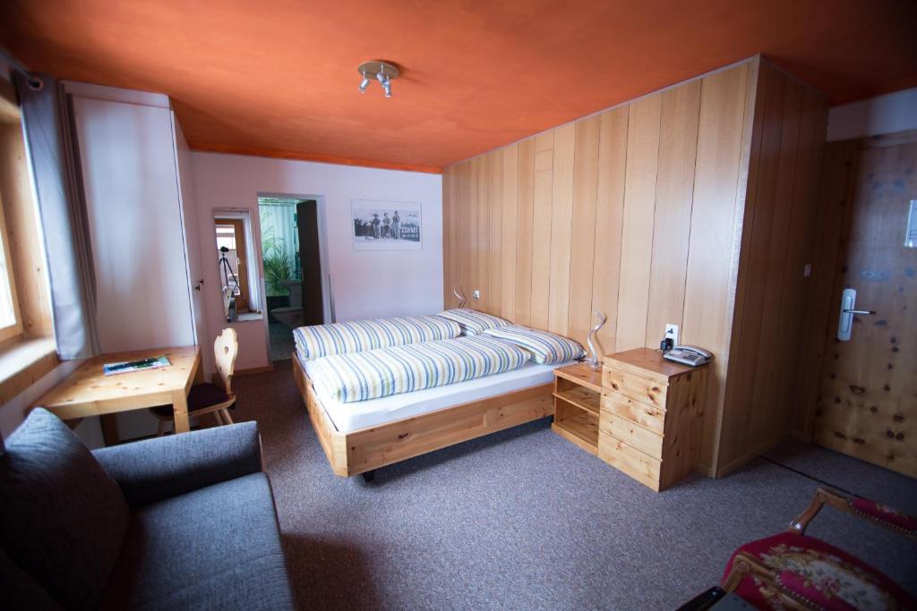 Postel nebo postele na pokoji v ubytování Hotel Hold AG