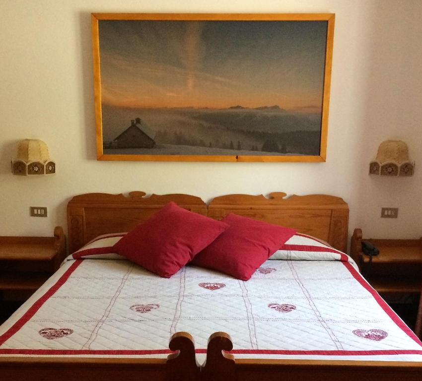 Postel nebo postele na pokoji v ubytování Hotel Villa Wilma
