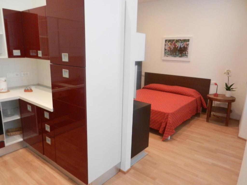 A bed or beds in a room at Central Guesthouse