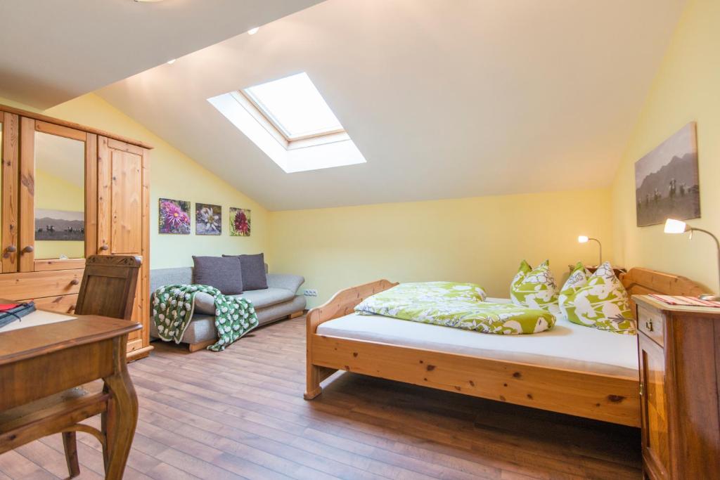 A bed or beds in a room at Biohof Maurachgut