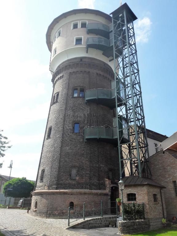 a building with a tower with a balcony on it at Wasserturm Angermünde in Angermünde