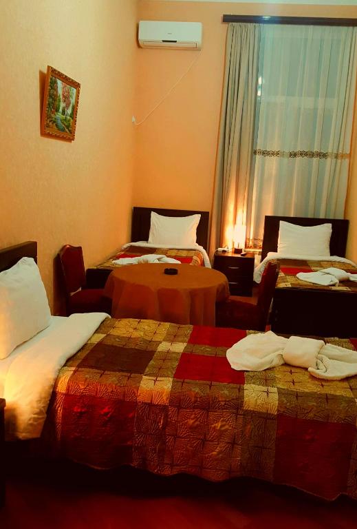 Postel nebo postele na pokoji v ubytování Hotel Sali