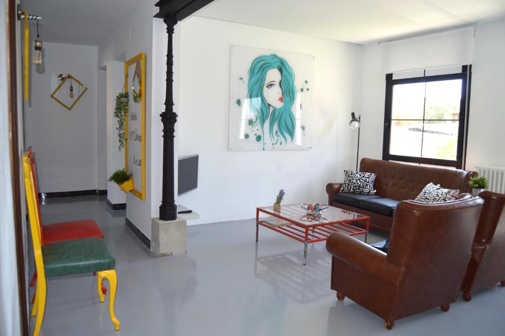A seating area at Ohana Apartamento Rural