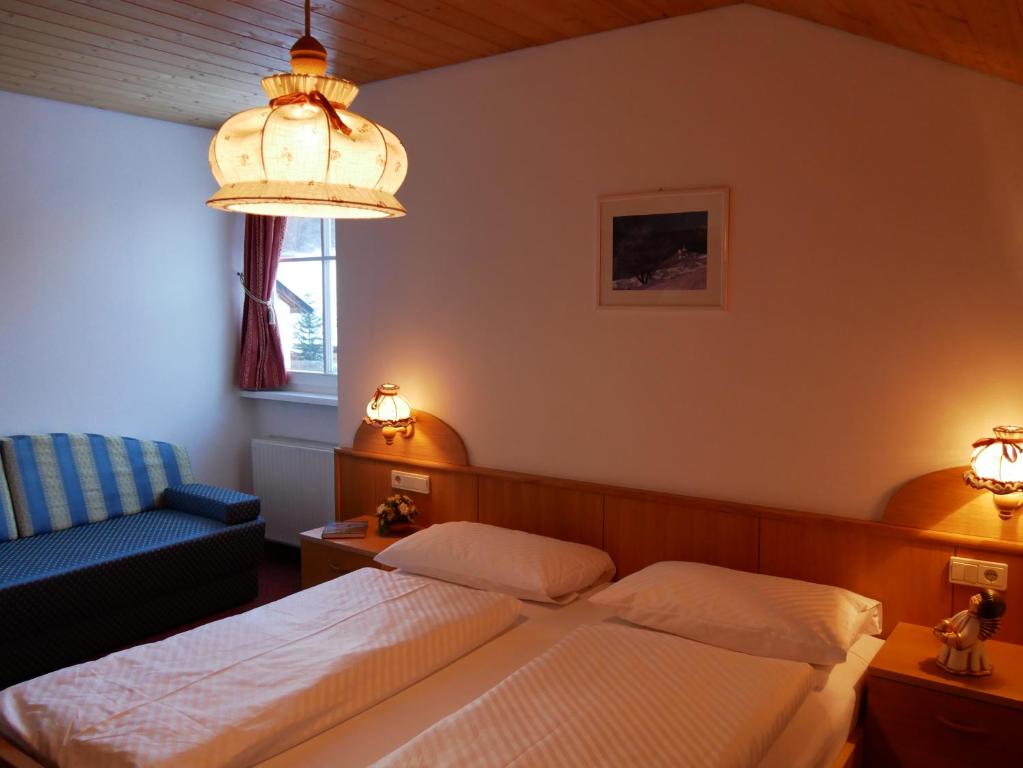 Postel nebo postele na pokoji v ubytování Appartmenthotel Residence Elvis