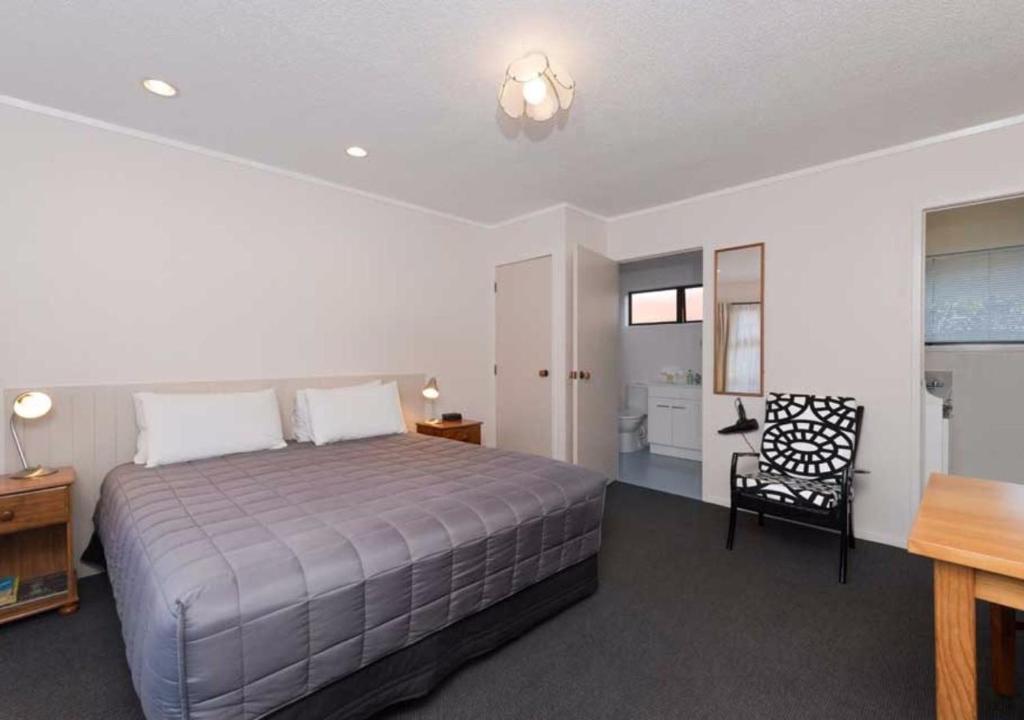 Postel nebo postele na pokoji v ubytování Edelweiss Motel