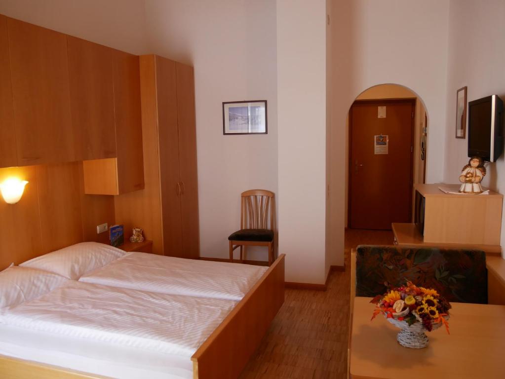 Postel nebo postele na pokoji v ubytování Appartmenthotel Residence Elvis