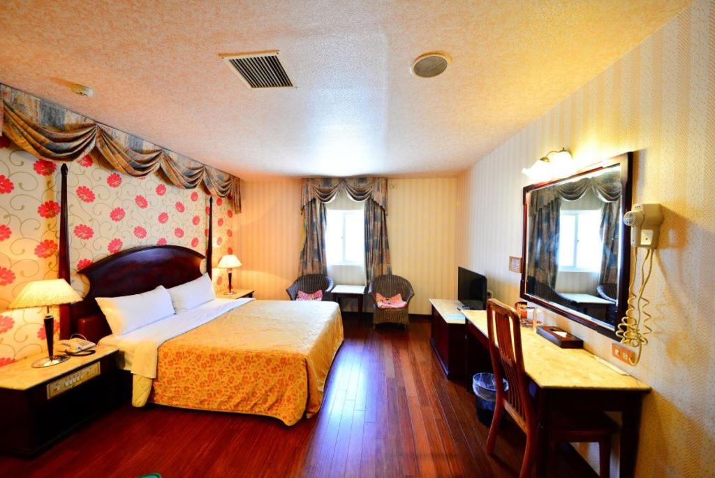 Postel nebo postele na pokoji v ubytování Paiwei Motel