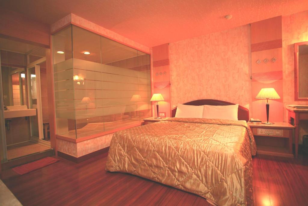 Postel nebo postele na pokoji v ubytování Paiwei Motel