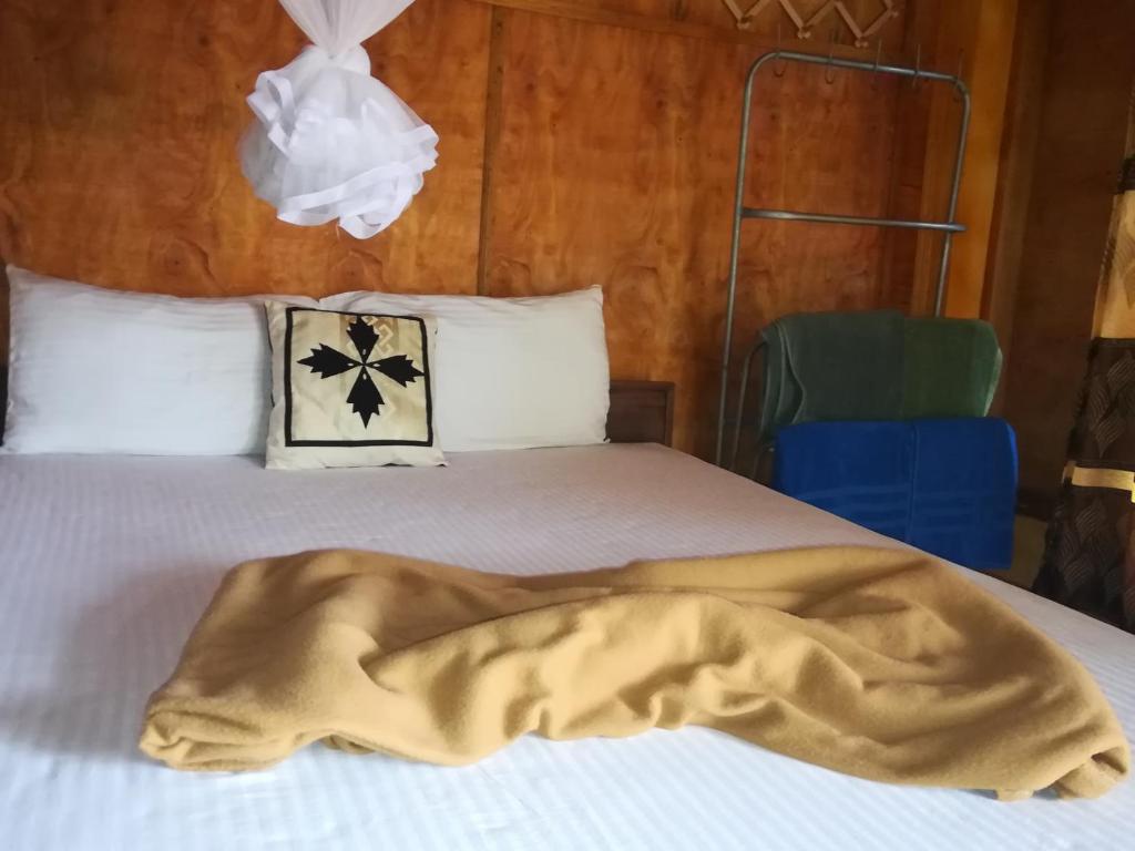 Postel nebo postele na pokoji v ubytování Sigiriya River Side Resort