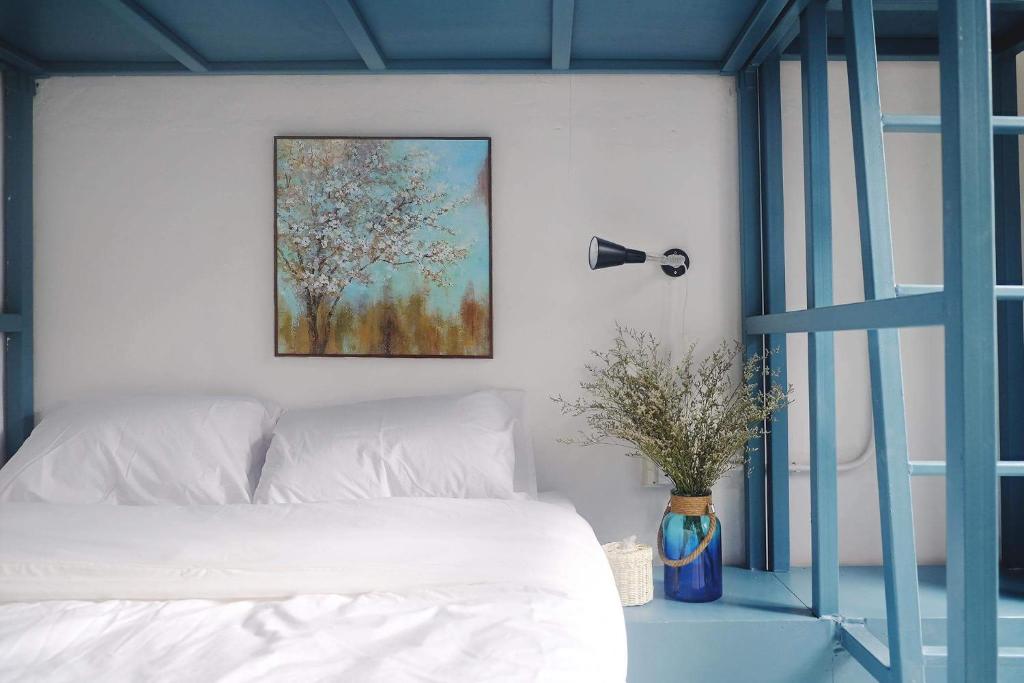 Postel nebo postele na pokoji v ubytování Aekkeko hostel