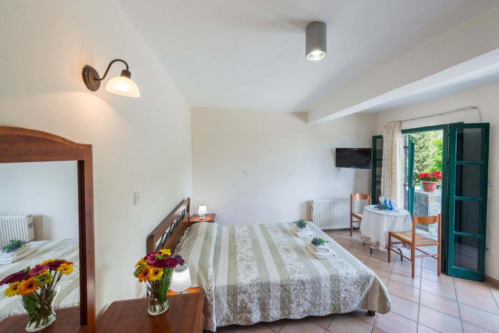 Postel nebo postele na pokoji v ubytování Themis House