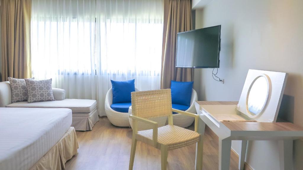TV a/nebo společenská místnost v ubytování Hiran Residence