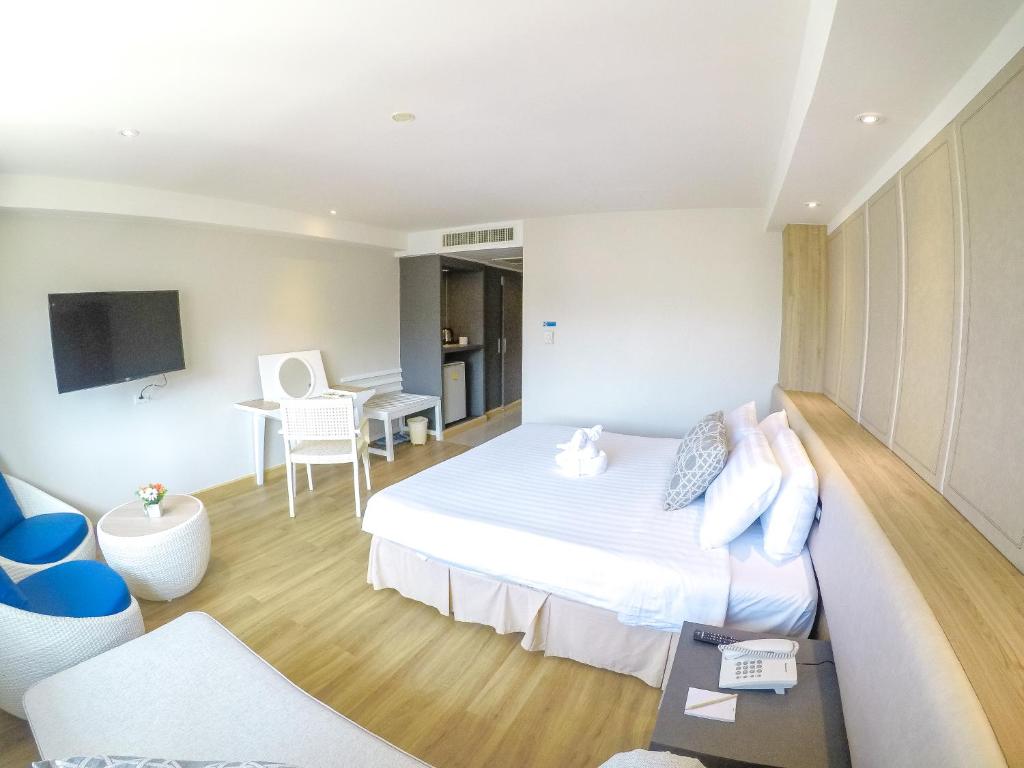 Postel nebo postele na pokoji v ubytování Hiran Residence