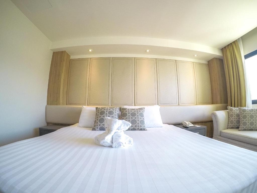 Postel nebo postele na pokoji v ubytování Hiran Residence