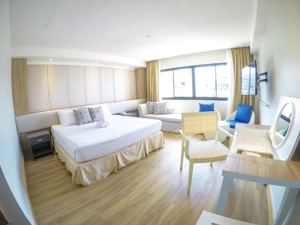 Postel nebo postele na pokoji v ubytování Hiran Residence
