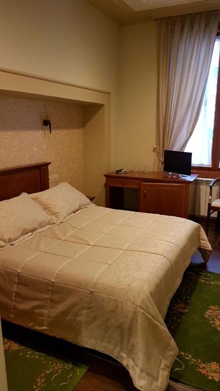 Postel nebo postele na pokoji v ubytování Vila Sigal Pogradec