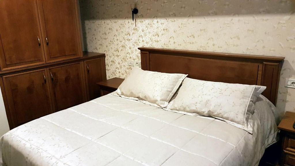Postel nebo postele na pokoji v ubytování Vila Sigal Pogradec