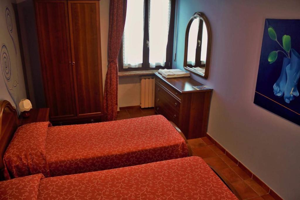 Postel nebo postele na pokoji v ubytování Ristorante Albergo 'l Bunet